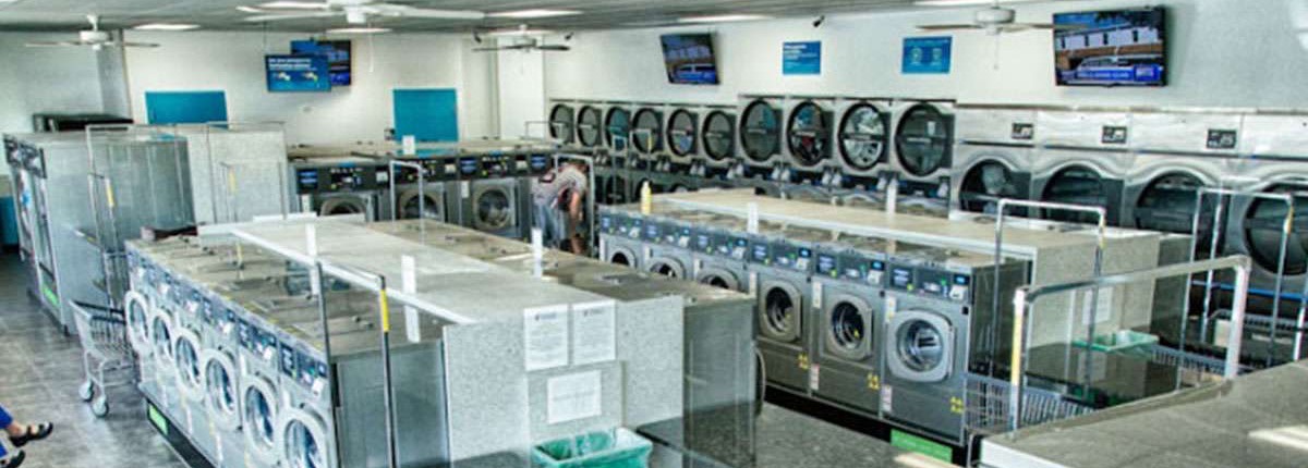 Wide view of the floor, granite folding stations between two banks of machines